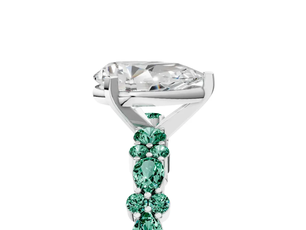 Pear Cut Diamond Side Stone Solitaire Ring with Round Green Sapphire and Four-Prong Setting Silver
