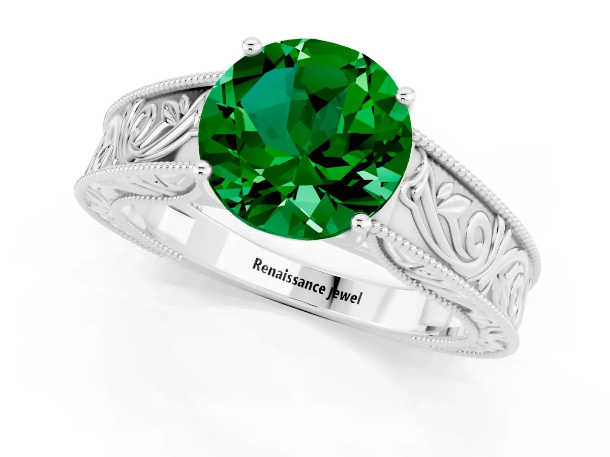 Round Cut Emerald Solitaire Ring with Engraved Band and Four-Prong Setting White gold