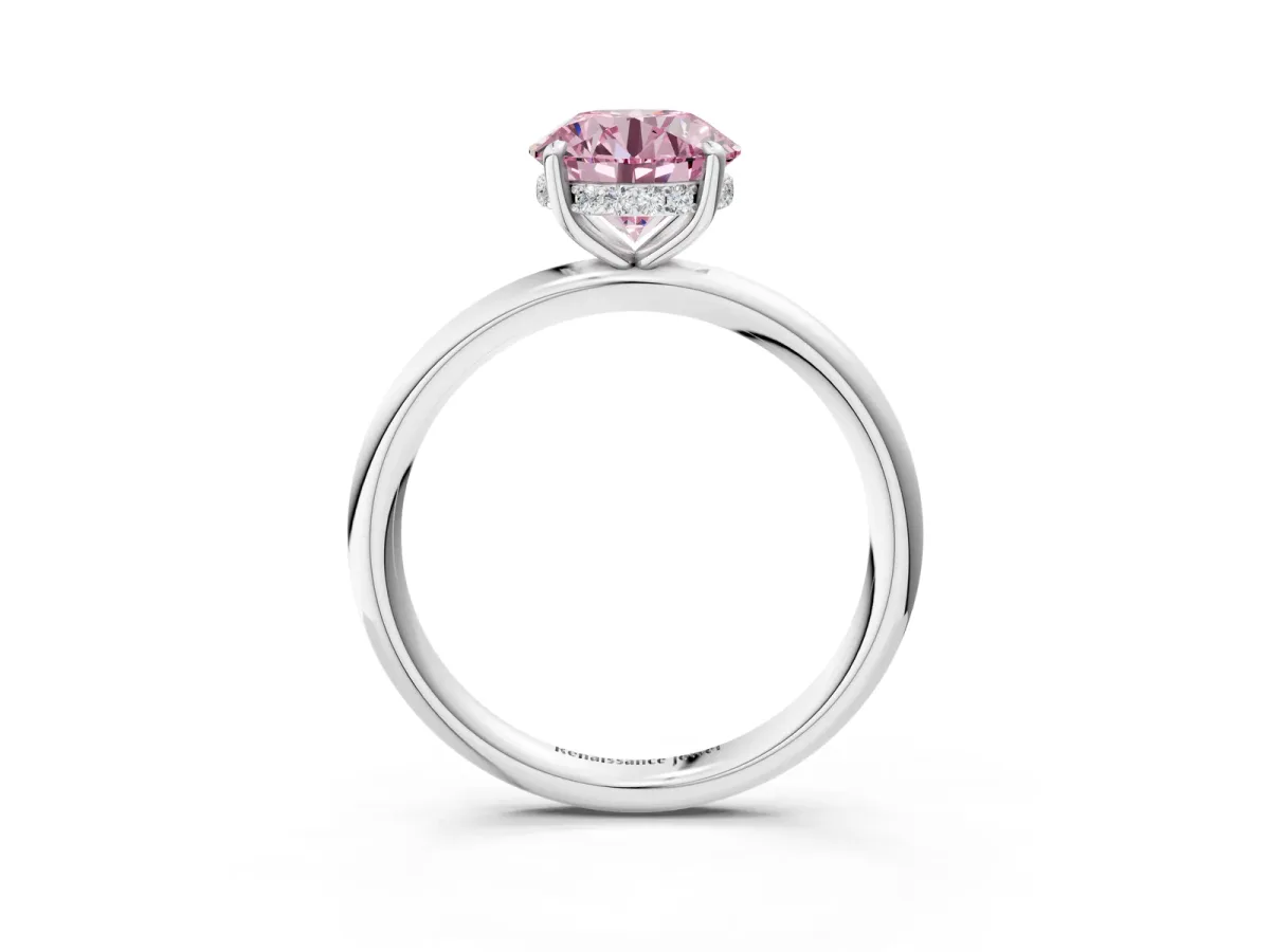 Fancy Pink Round Cut Diamond Solitaire Ring with Thin Band and Four-Prong Setting Silver