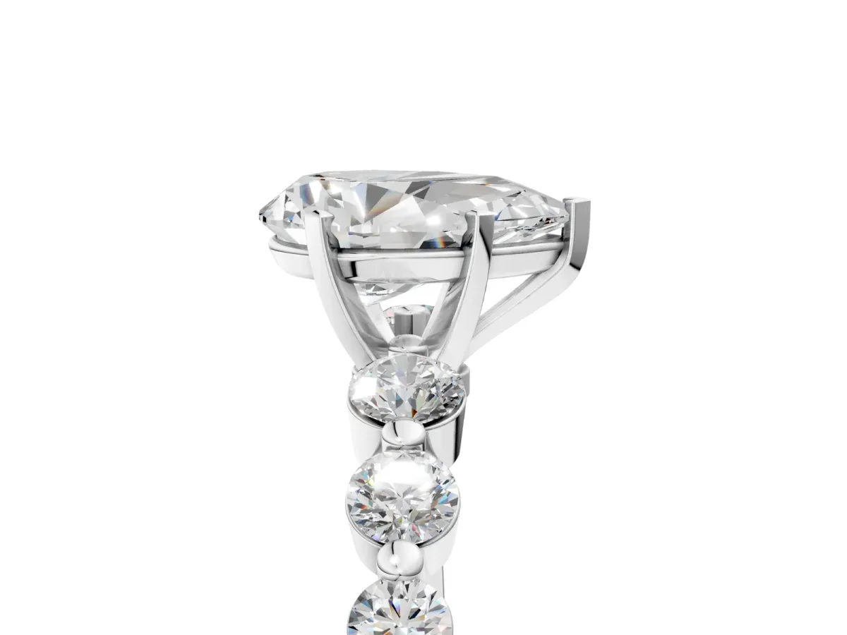 Pear Cut Solitaire Diamond Ring with Pave Band and Four-Prong Setting Silver