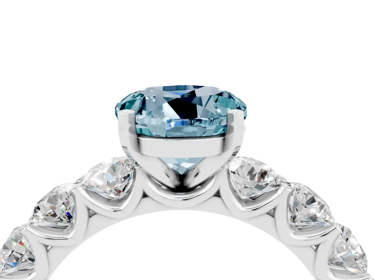 Round Cut Aquamarine Prong Setting with Side Stones on a Pave Band Silver