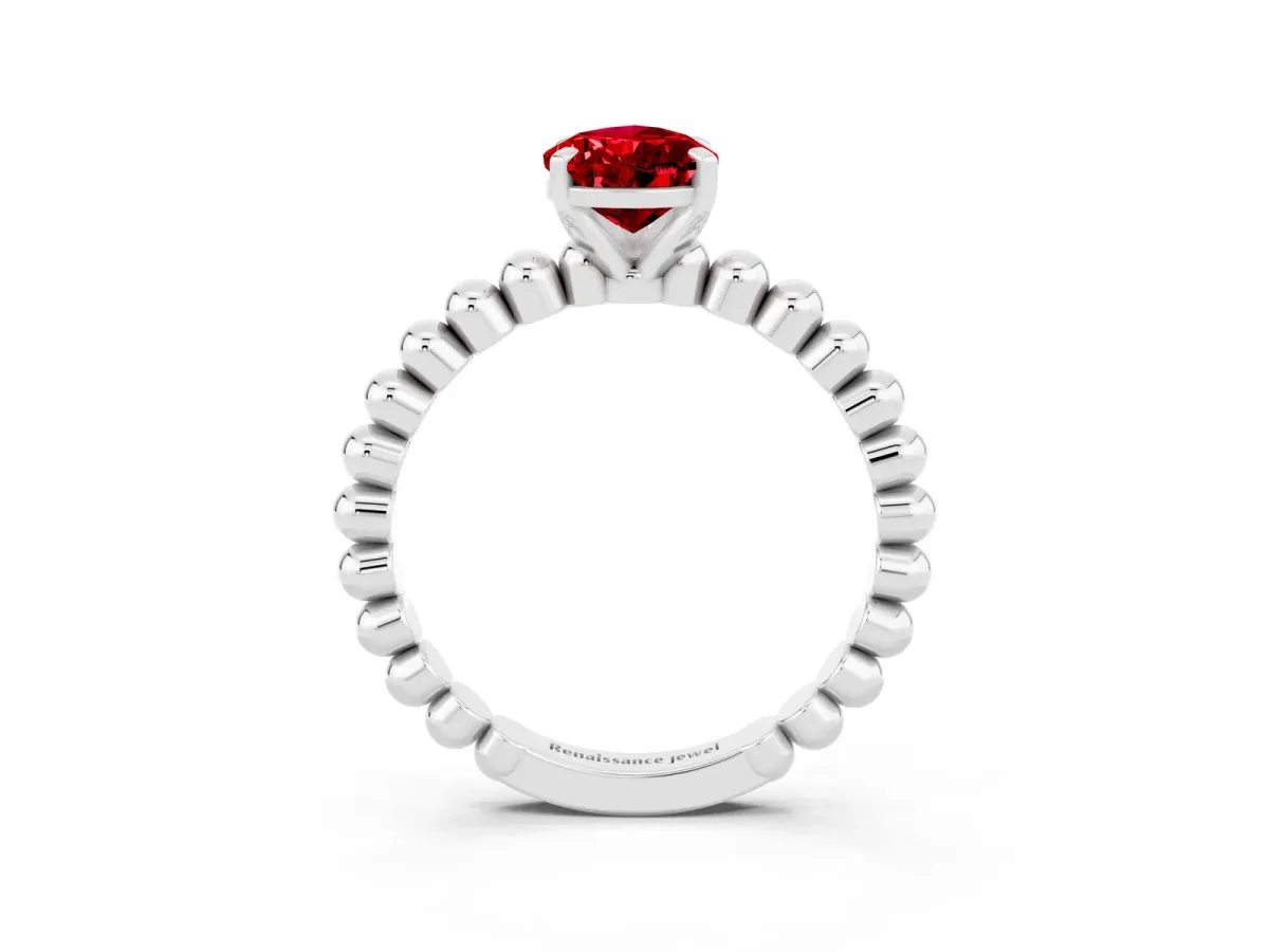 Pear Cut Ruby Solitaire Ring with Beaded Band and Prong Setting Silver