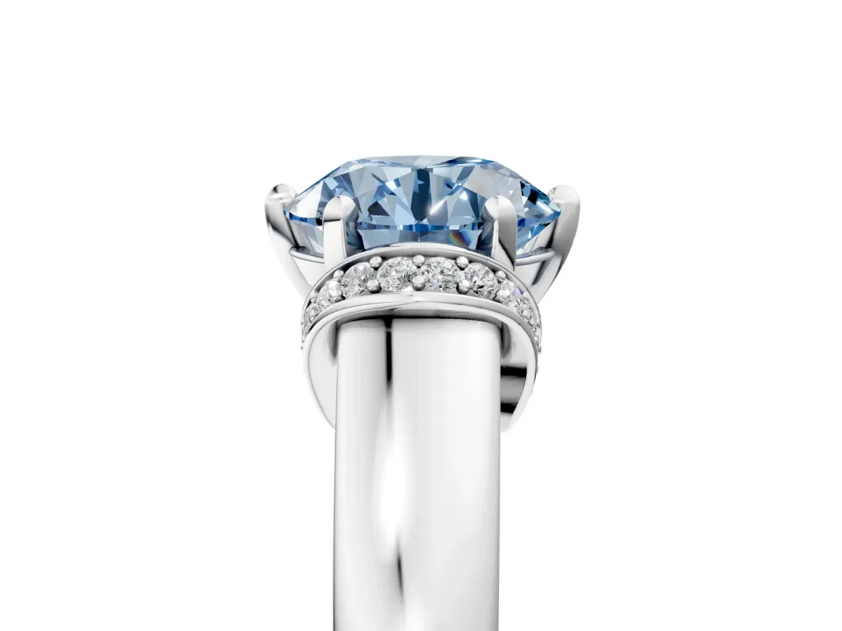 Fancy Blue Round Cut Solitaire Diamond Ring with Pave Band and Six-Prong Setting Silver