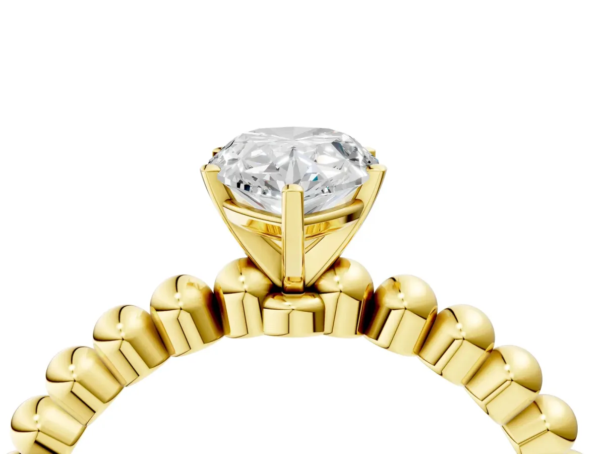Pear Cut Diamond Solitaire Ring with Beaded Band and Prong Setting Yellow gold