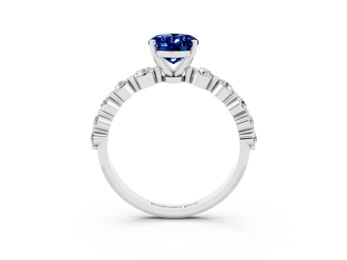 Oval Cut Solitaire Blue Sapphire Ring with Pave Band and Four-Prong Setting Silver