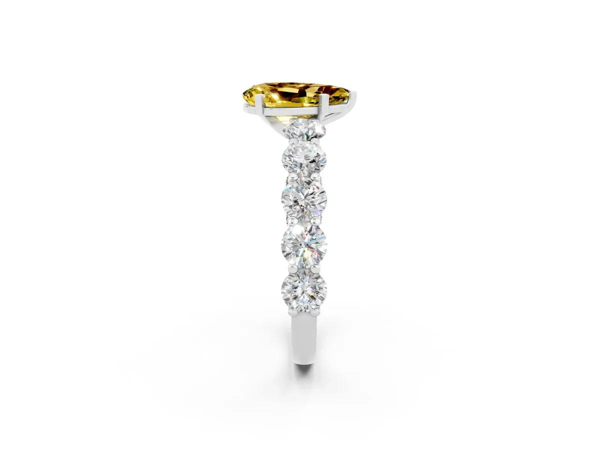 Pear Cut Yellow Sapphire Prong Setting with Side Stones on a Pave Band Silver