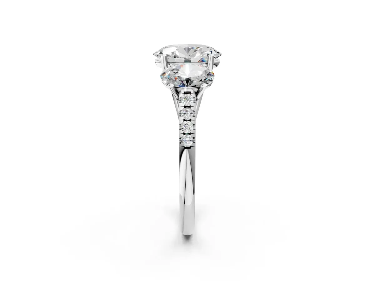 Three-Stone Oval Cut Diamond Ring with Round Pavé Band and Prong Setting Platinum