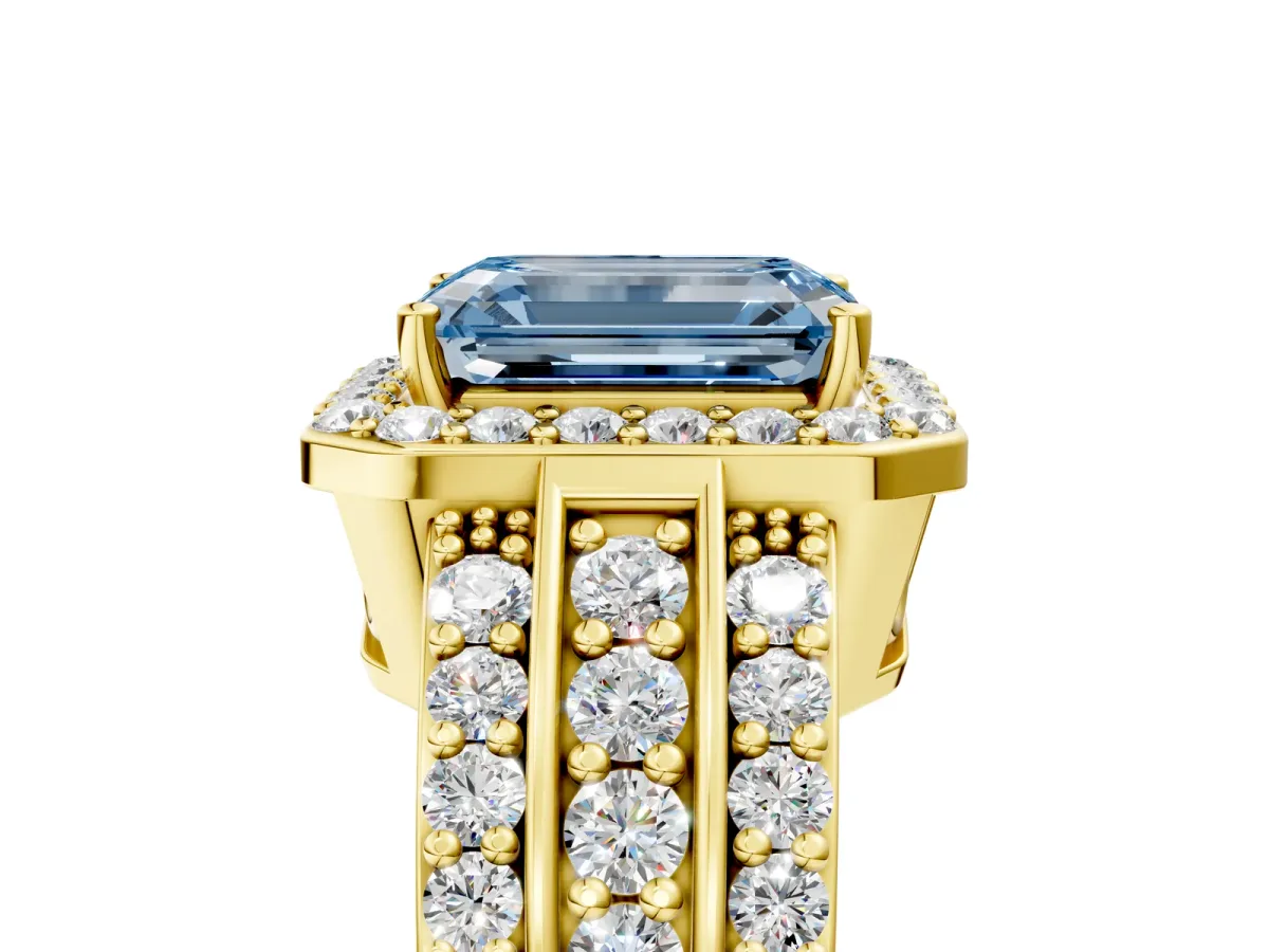Fancy Blue Emerald Cut Halo Diamond Ring with Round Split Shank and Prong Setting Yellow gold