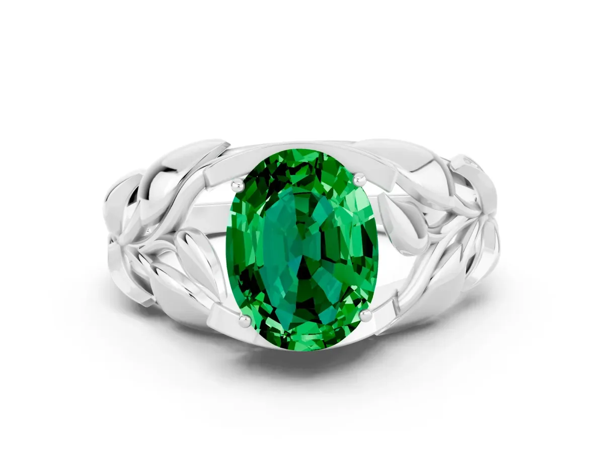 Oval Cut Emerald Leaf-Inspired Engagement Ring with Round Accents and Prong Setting Platinum