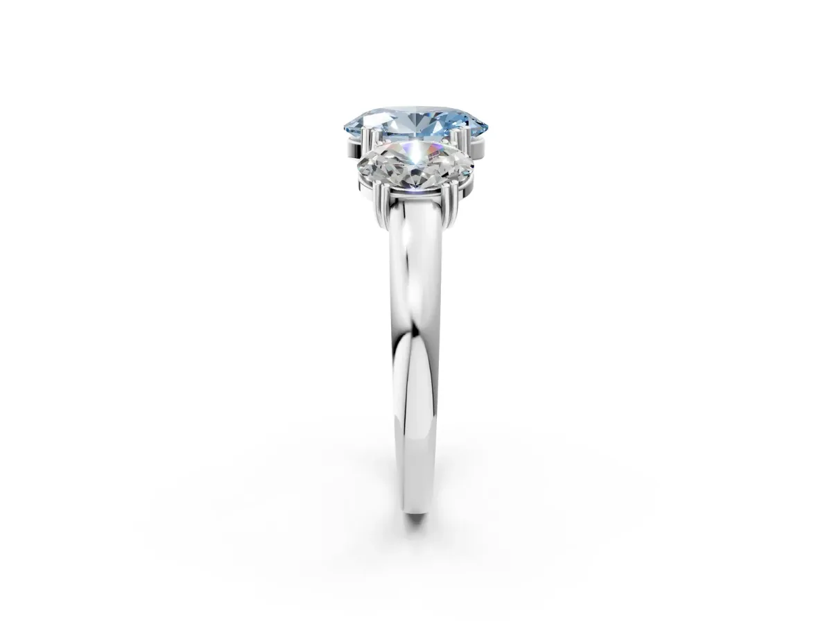 Fancy Blue Three-Stone Oval Cut Cut Diamond Ring with Channel Set Band and Four-Prong Setting Silver