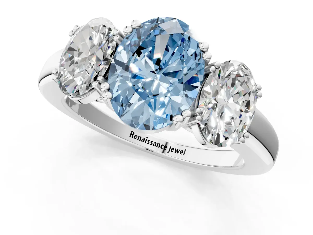 Fancy Blue Three-Stone Oval Cut Cut Diamond Ring with Channel Set Band and Four-Prong Setting Silver