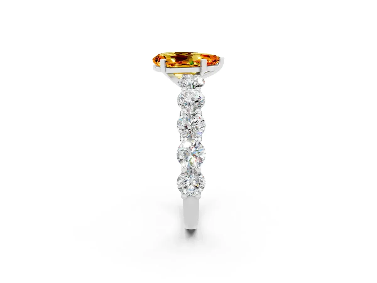 Pear Cut Citrine Prong Setting with Side Stones on a Pave Band Silver