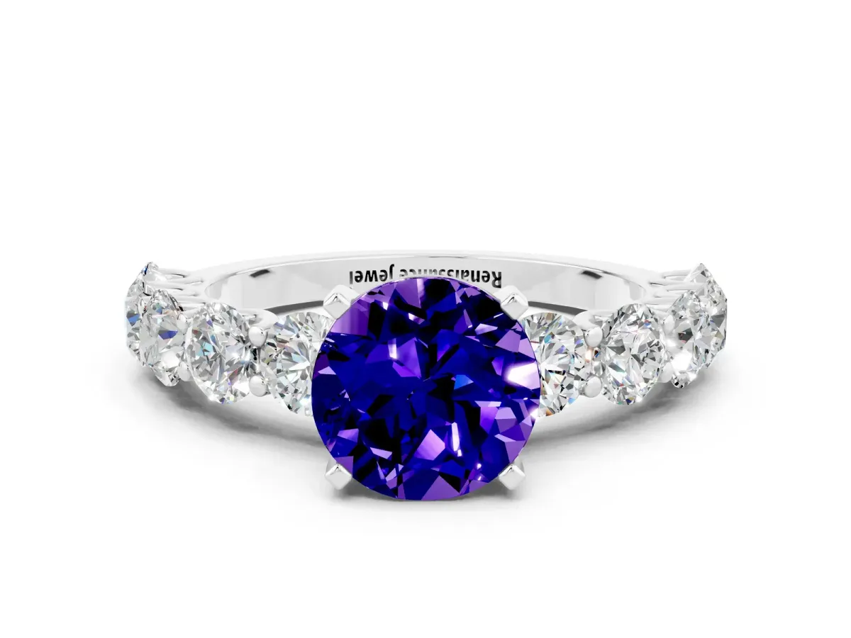 Round Cut Tanzanite Prong Setting with Side Stones on a Pave Band Silver