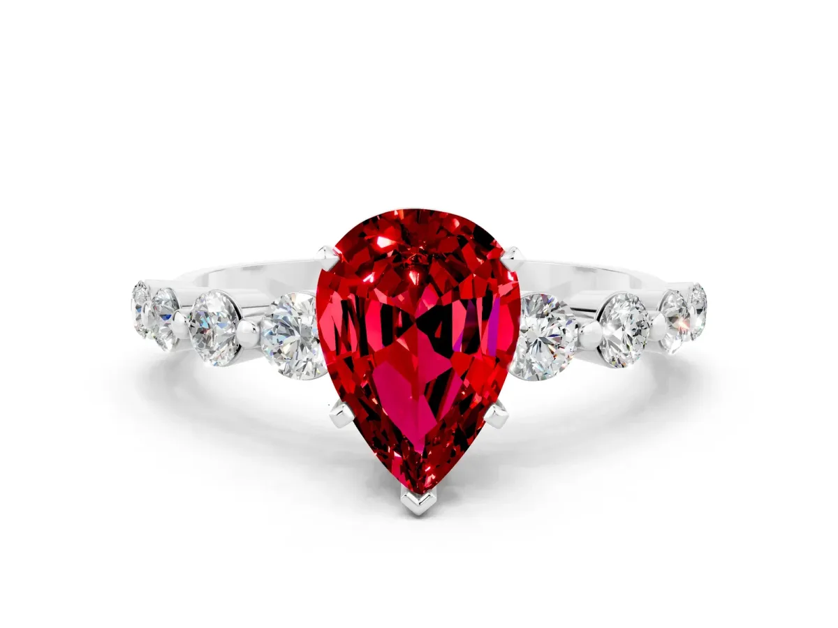 Pear Cut Solitaire Ruby Ring with Pave Band and Four-Prong Setting Platinum