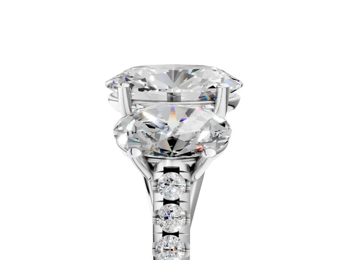 Three-Stone Oval Cut Diamond Ring with Round Pavé Band and Prong Setting Platinum