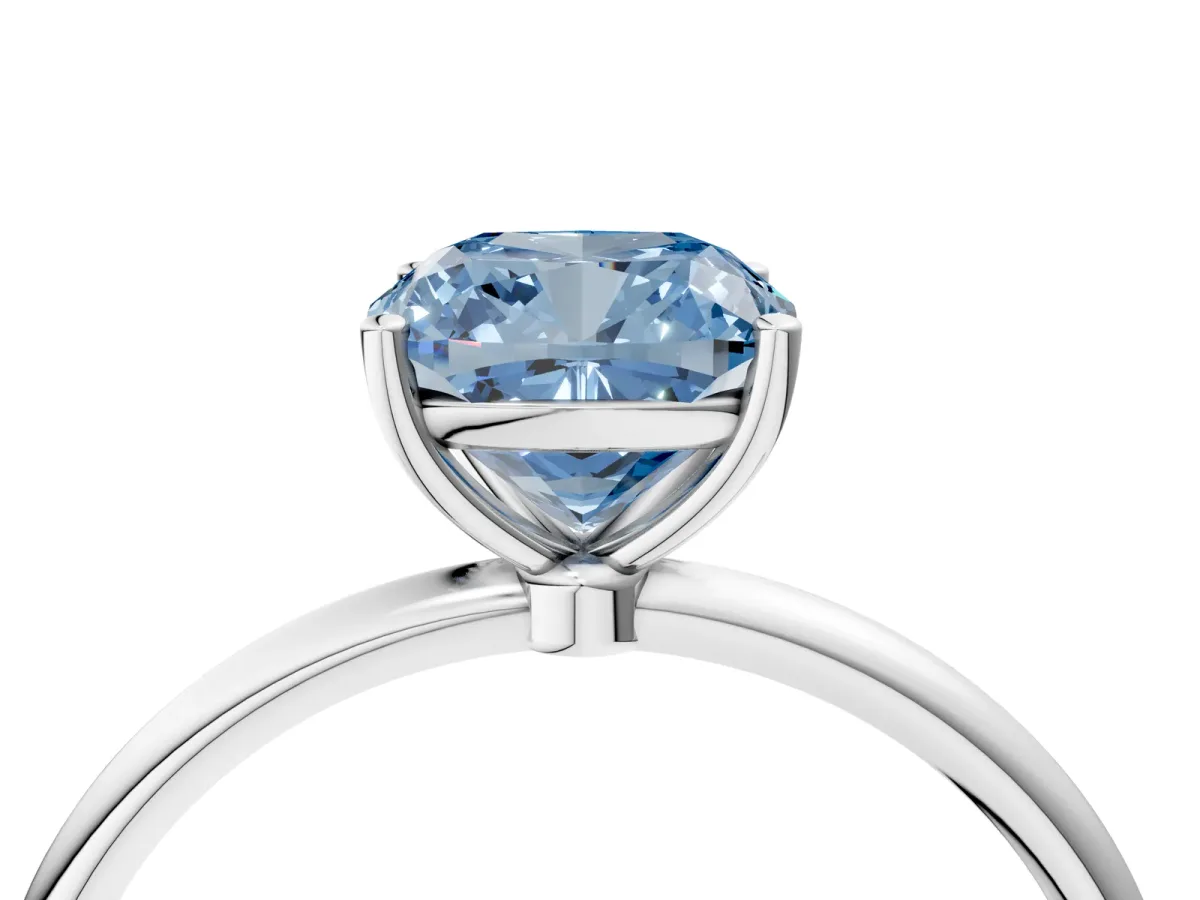 Fancy Blue Cushion Cut Cut Solitaire Engagement Ring with Thin Band and Four-Prong Setting Silver