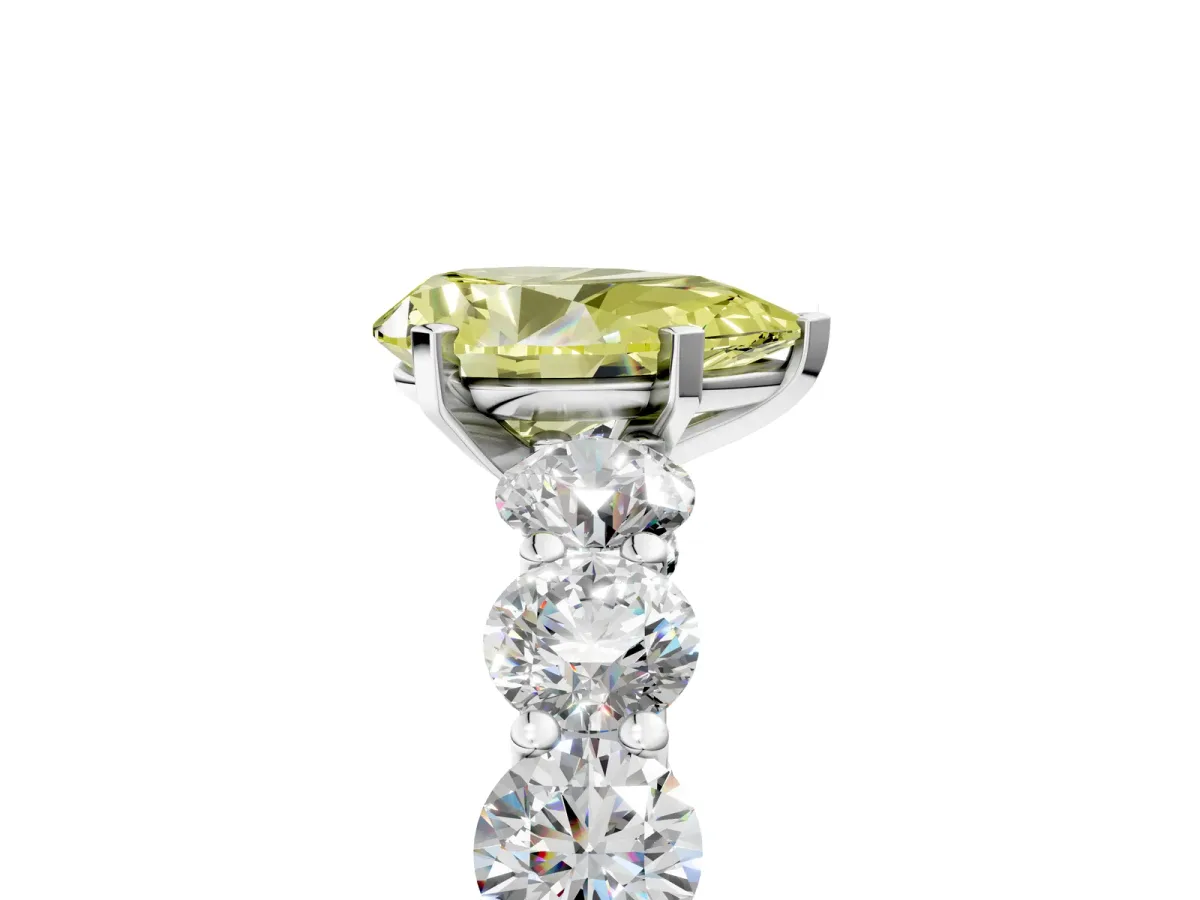 Fancy Yellow Pear Cut Diamond Prong Setting with Side Stones on a Pave Band Silver