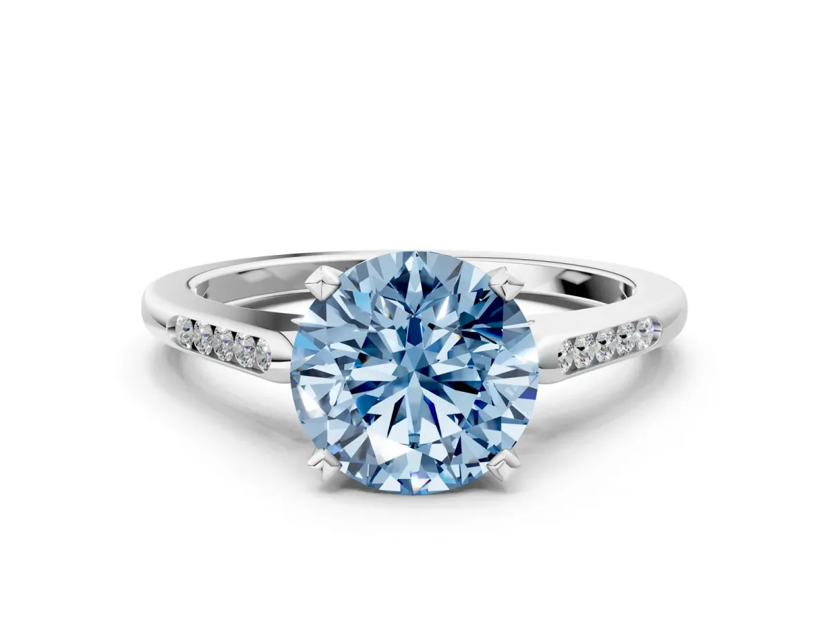 Fancy Blue Round Cut Diamond Solitaire Ring with Channel Set Round Band and Prong Setting Silver