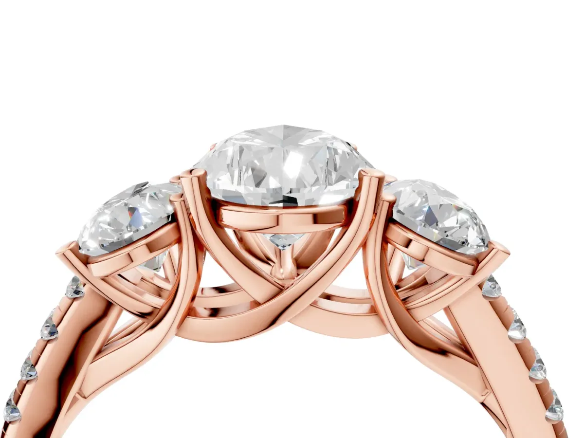Three-Stone Pear Cut Diamond Ring with Round Pavé Band and Prong Setting Rose gold