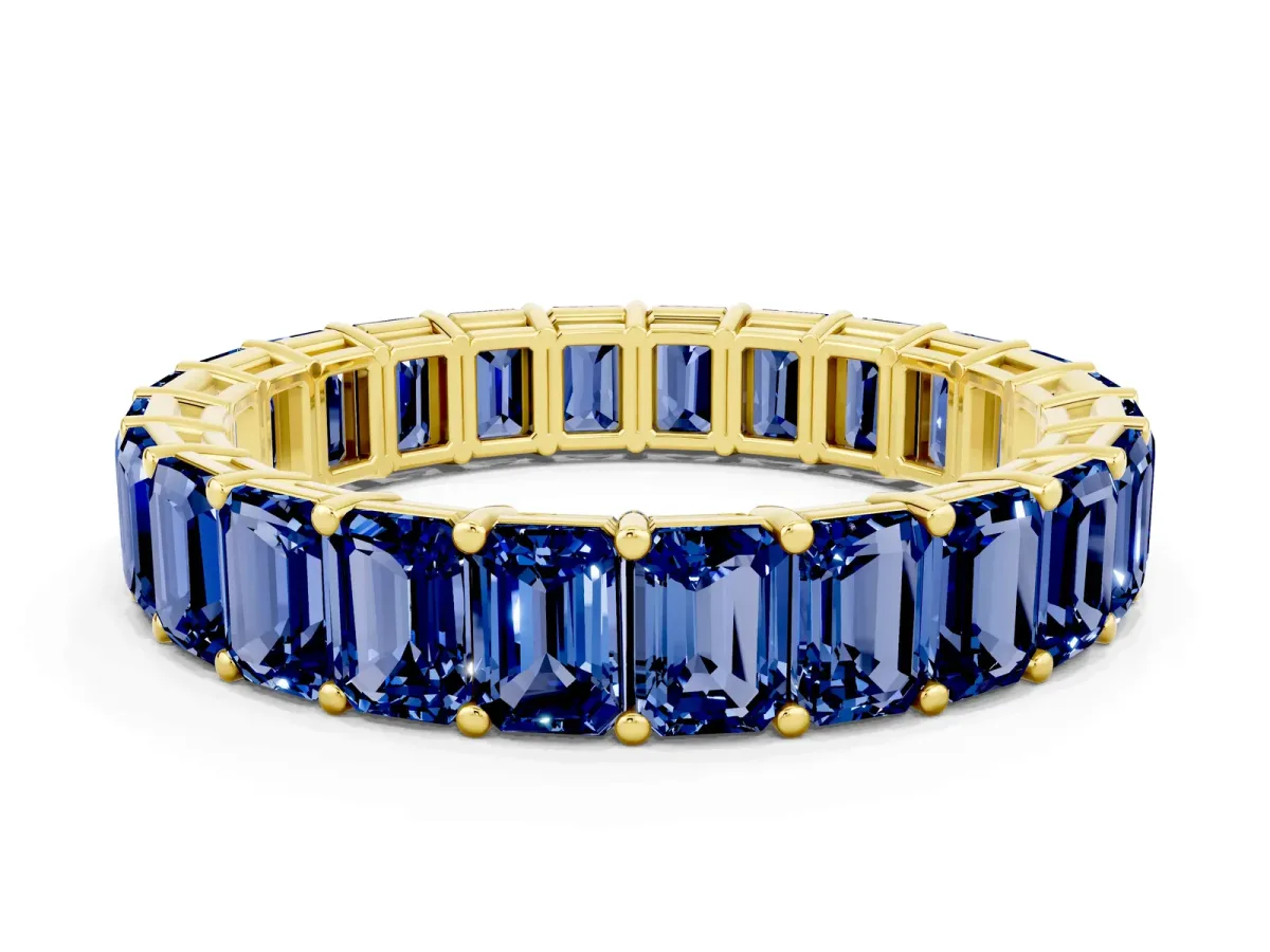 Emerald Cut Blue Sapphire Eternity Band with Shared Prong Setting Yellow gold