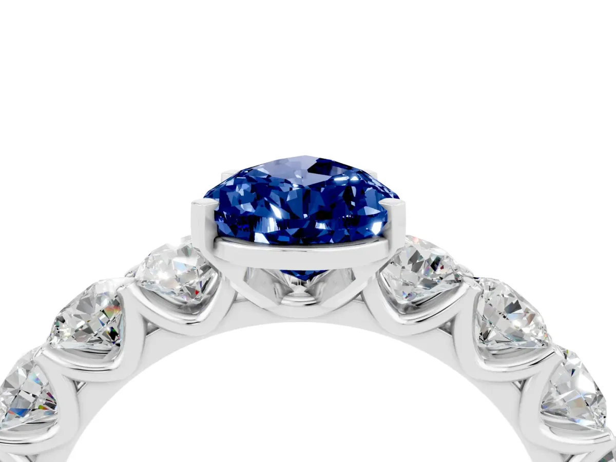 Pear Cut Blue Sapphire Prong Setting with Side Stones on a Pave Band Silver