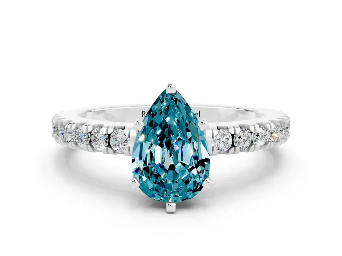 Pear Cut Solitaire Blue Topaz with Pavé Band and Four-Prong Setting Silver