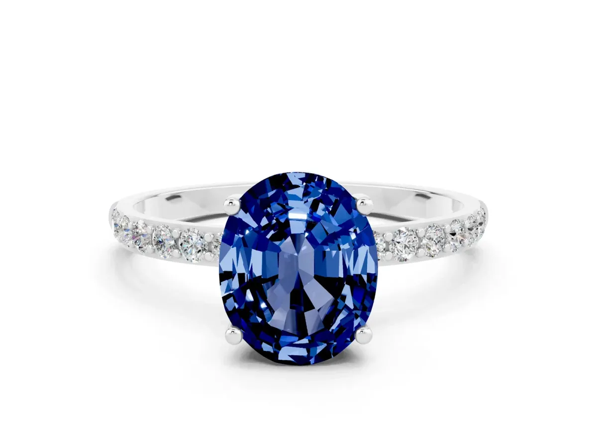 Oval Cut Blue Sapphire Solitaire Ring with Round Pavé Band and Prong Setting Silver