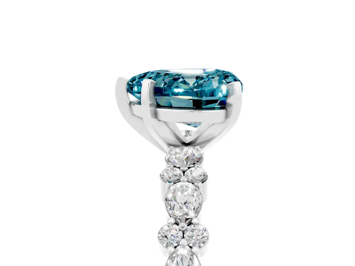 Heart Cut Blue Topaz Side Stone Solitaire Ring with Round and Four-Prong Setting Silver