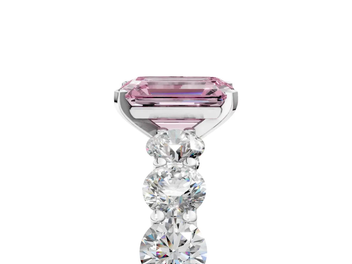 Fancy Pink Emerald Cut Diamond Prong Setting with Side Stones on a Pave Band Platinum