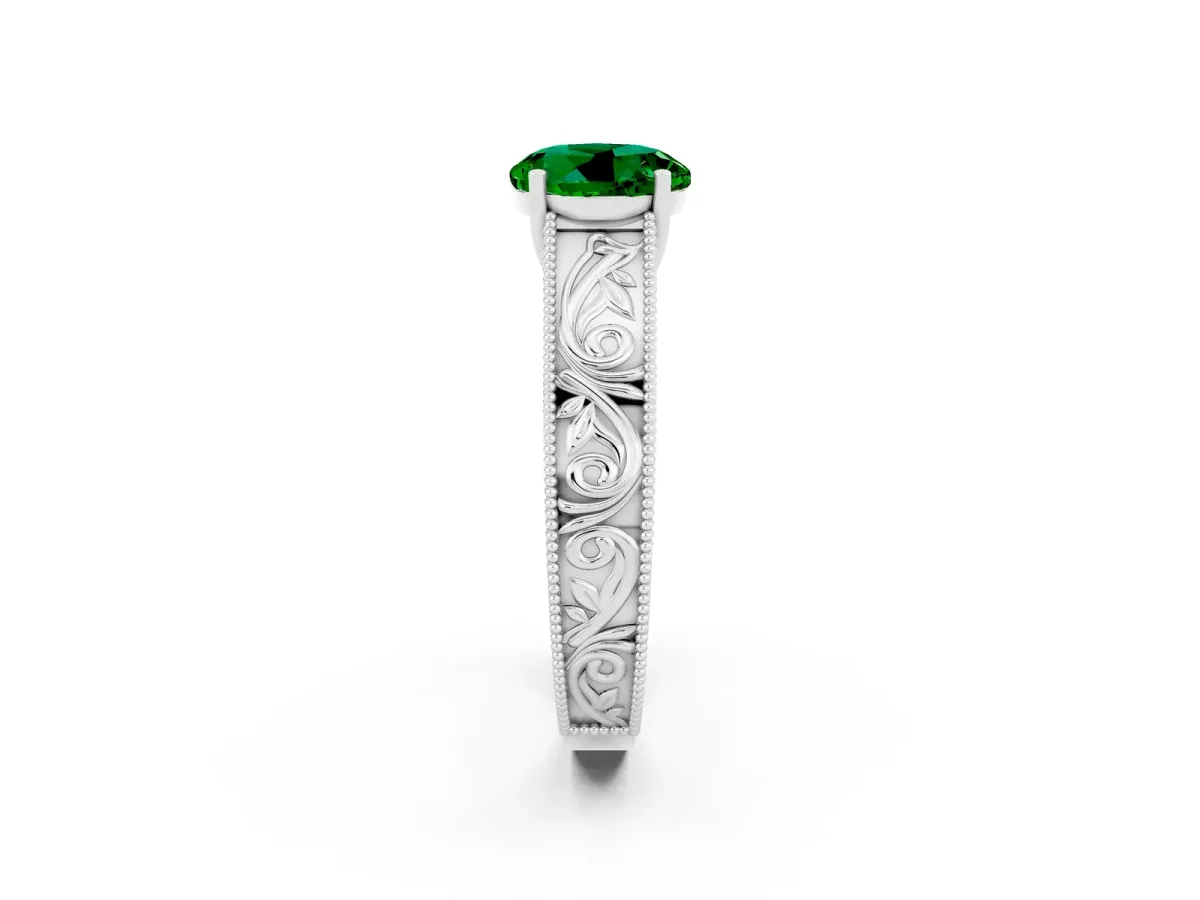 Round Cut Emerald Solitaire Ring with Engraved Band and Four-Prong Setting White gold