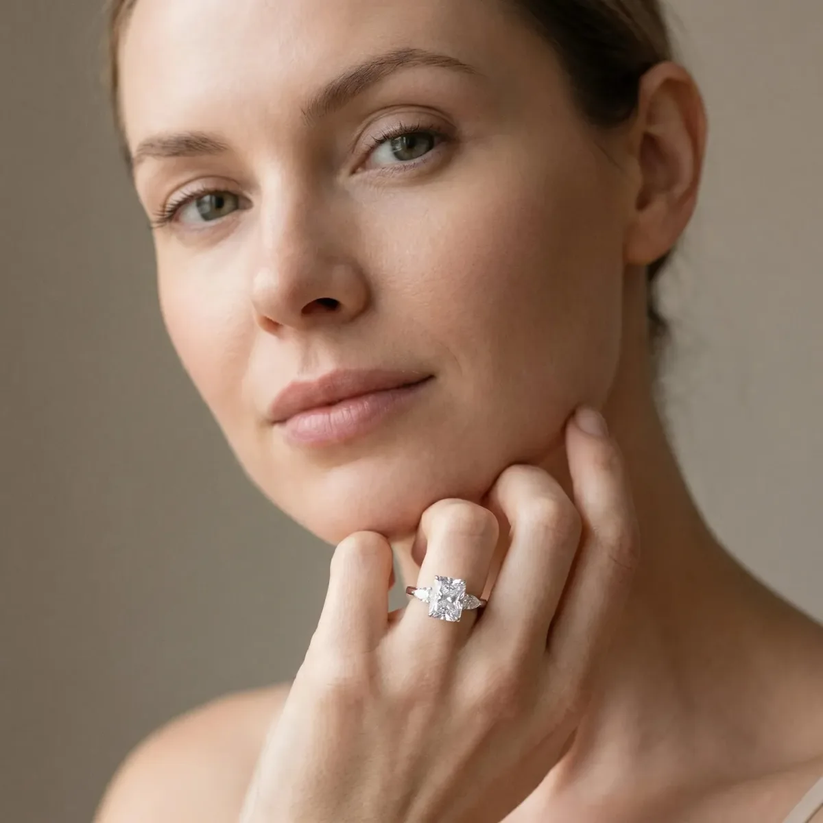 Three-Stone Radiant Cut Diamond Ring with Pear Side Stones in Four-Prong Setting Platinum