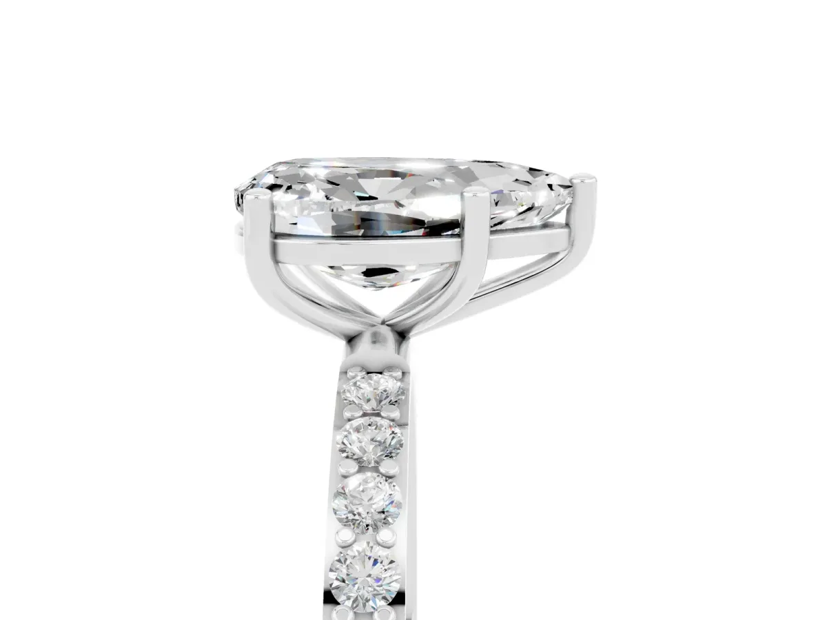 Pear Cut Moissanite Solitaire Ring with Round Pavé Band and Prong Setting Silver