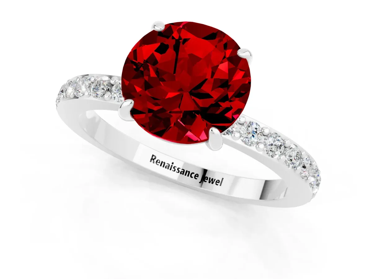 Round Cut Ruby Solitaire Engagement Ring with Pavé Band and Four-Prong Setting Silver