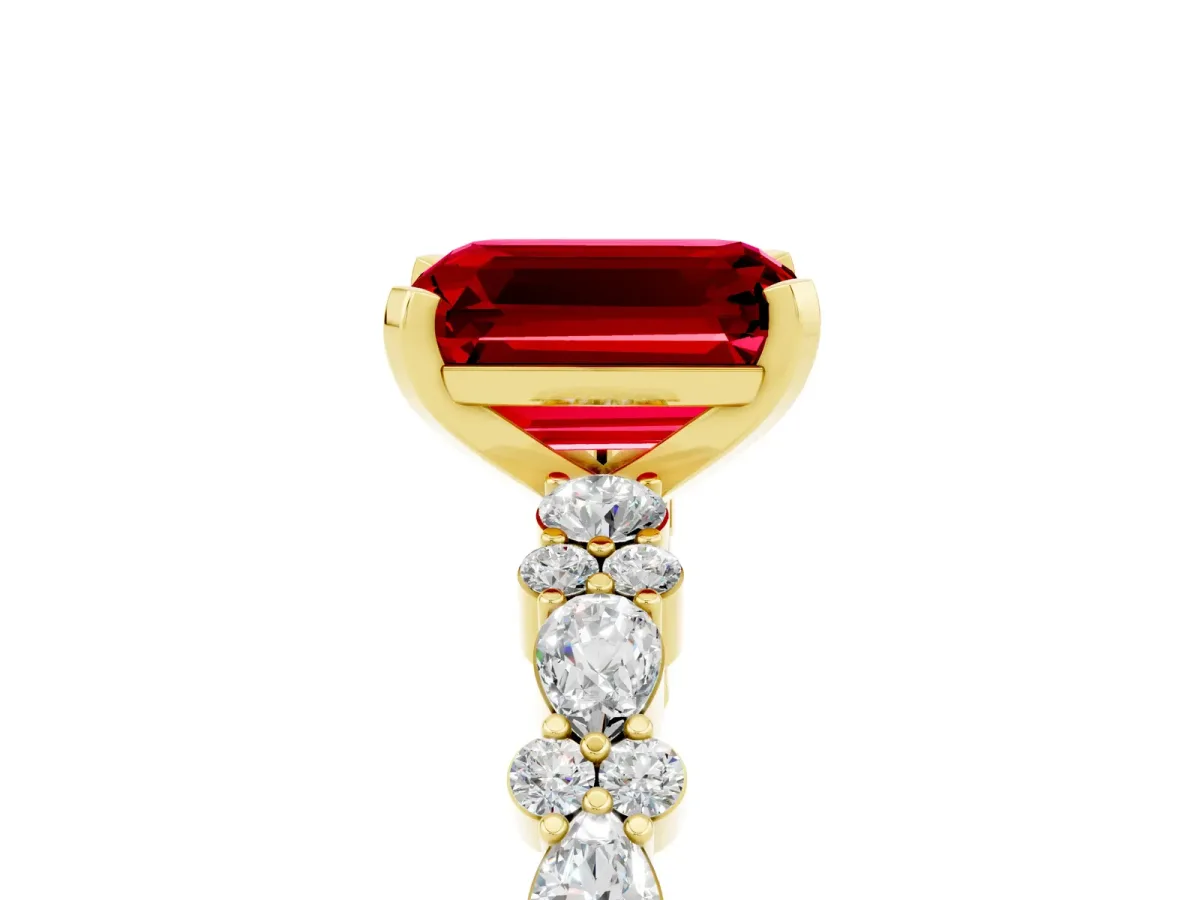 Emerald Cut Ruby Side Stone Solitaire Ring with Round and Four-Prong Setting Yellow gold