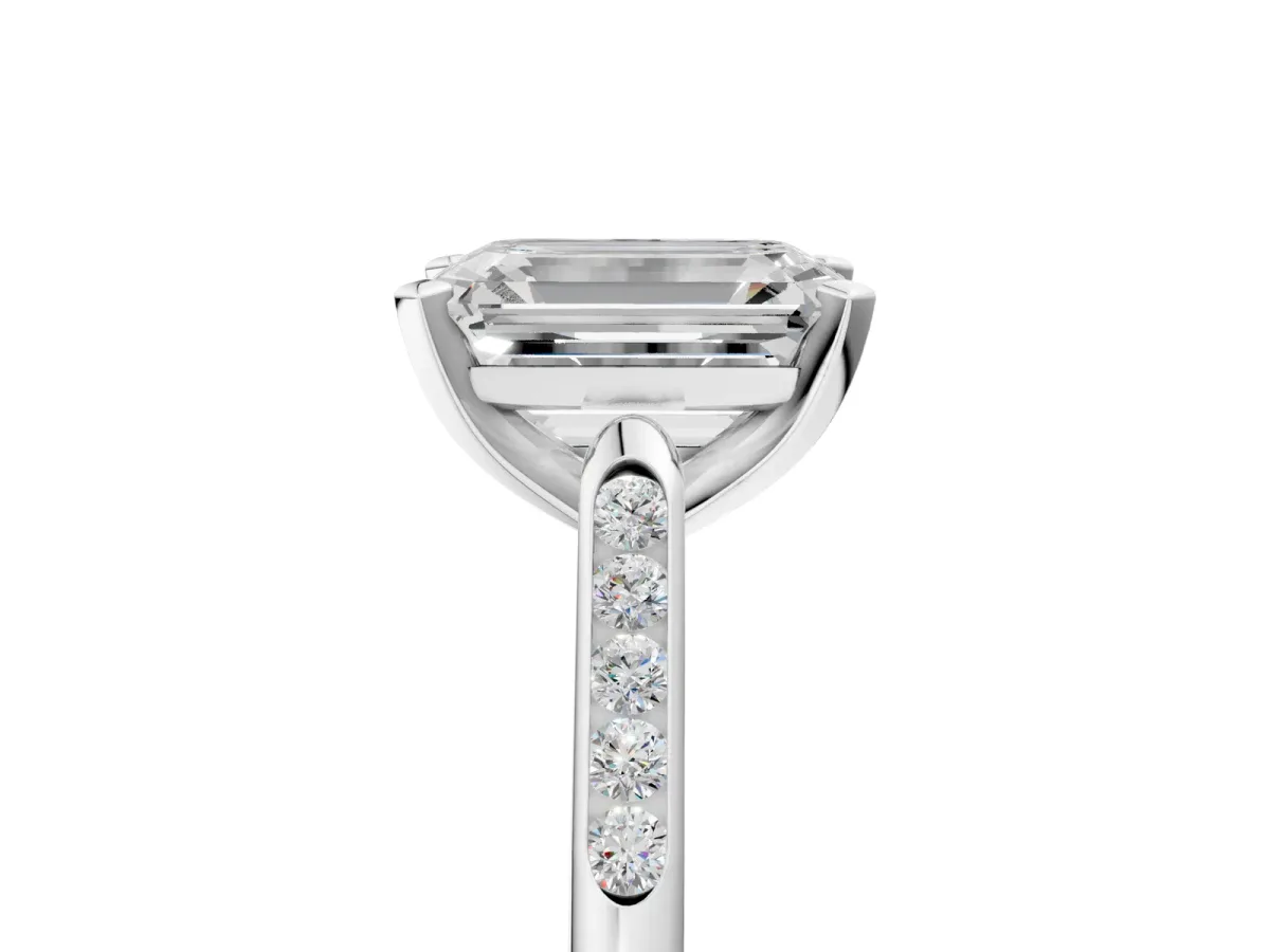 Emerald Cut Diamond Solitaire Ring with Channel Set Round Band and Prong Setting Silver