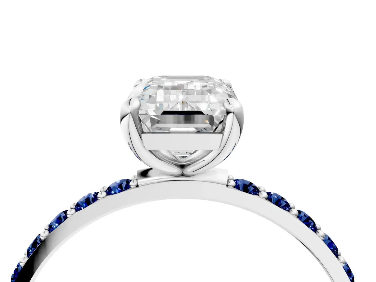 Emerald Cut Diamond Solitaire Ring with Round Blue Sapphire Pavé Band and Prong Setting Silver