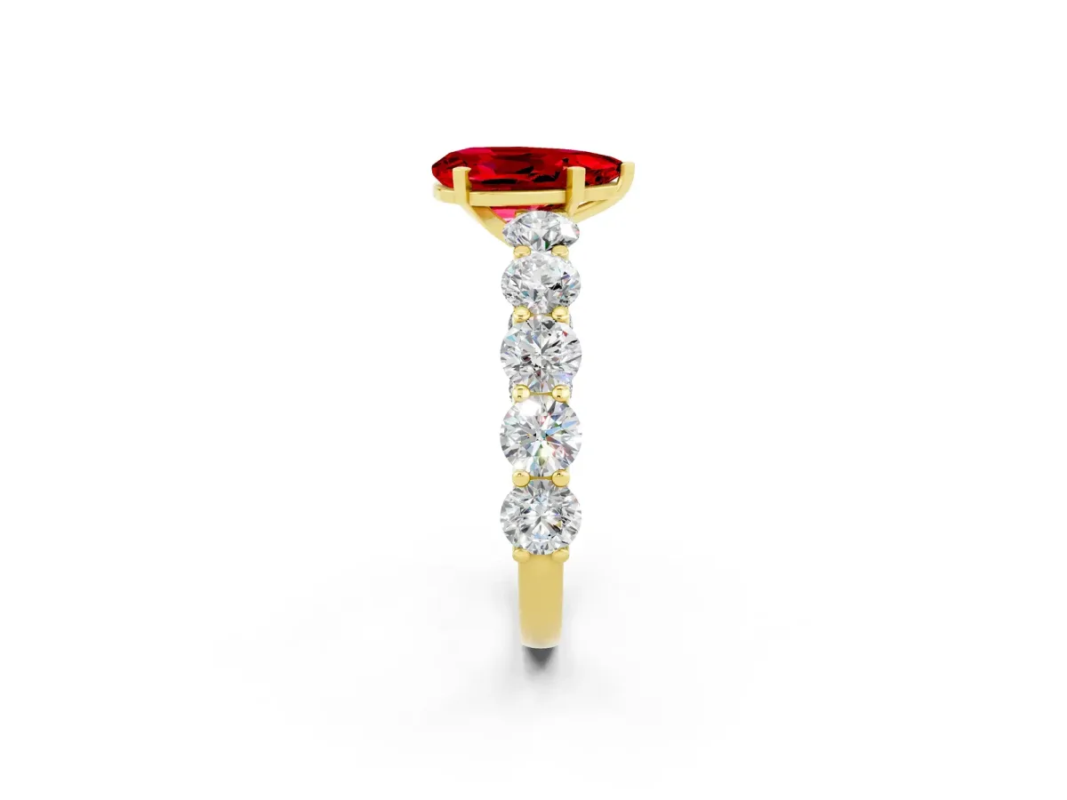 Pear Cut Ruby Prong Setting with Side Stones on a Pave Band Yellow gold