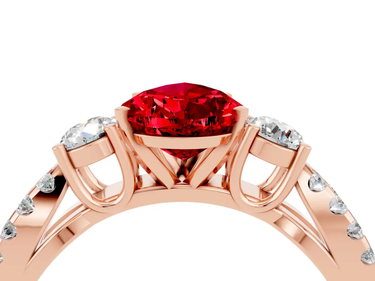 Pear Cut Ruby Three-Stone Ring with Pavé Split Shank and Four-Prong Setting Rose gold
