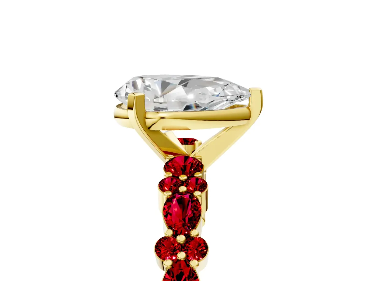 Pear Cut Diamond Side Stone Solitaire Ring with Round Ruby and Four-Prong Setting Yellow gold