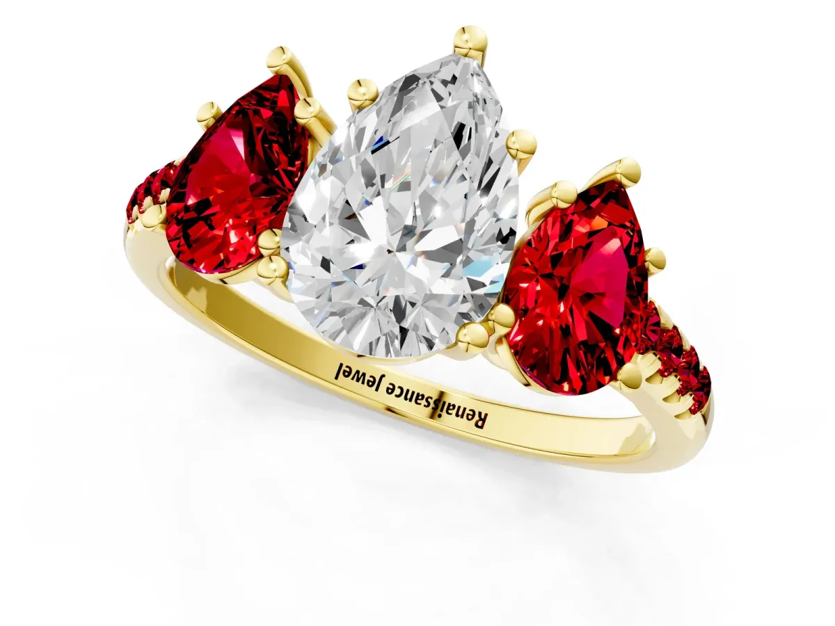 Three-Stone Pear Cut Diamond Ring with Round Ruby Pavé Band and Prong Setting Yellow gold