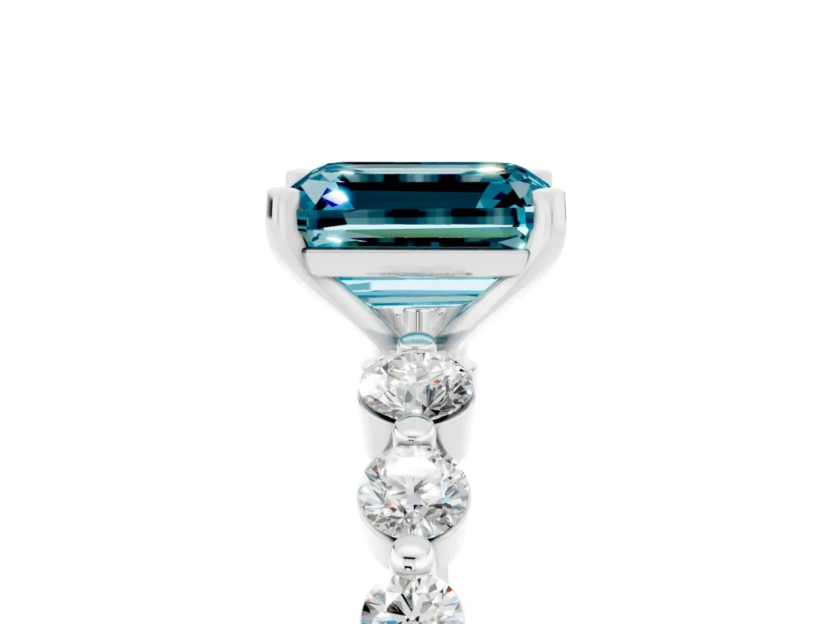 Emerald Cut Solitaire Blue Topaz Ring with Pave Band and Four-Prong Setting Platinum