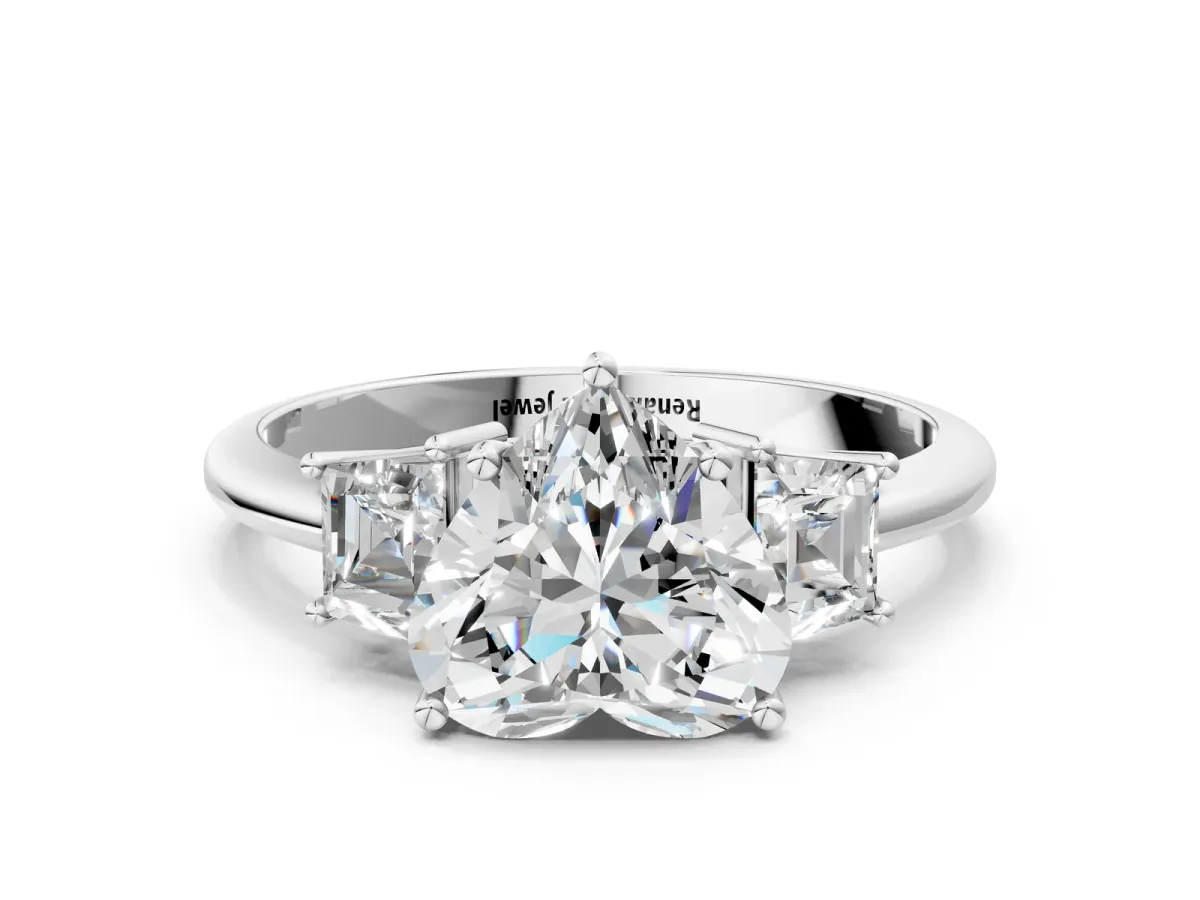 Heart Cut Diamond Three-Stone Ring with Trapezoid Side Stones and Prong Setting Platinum