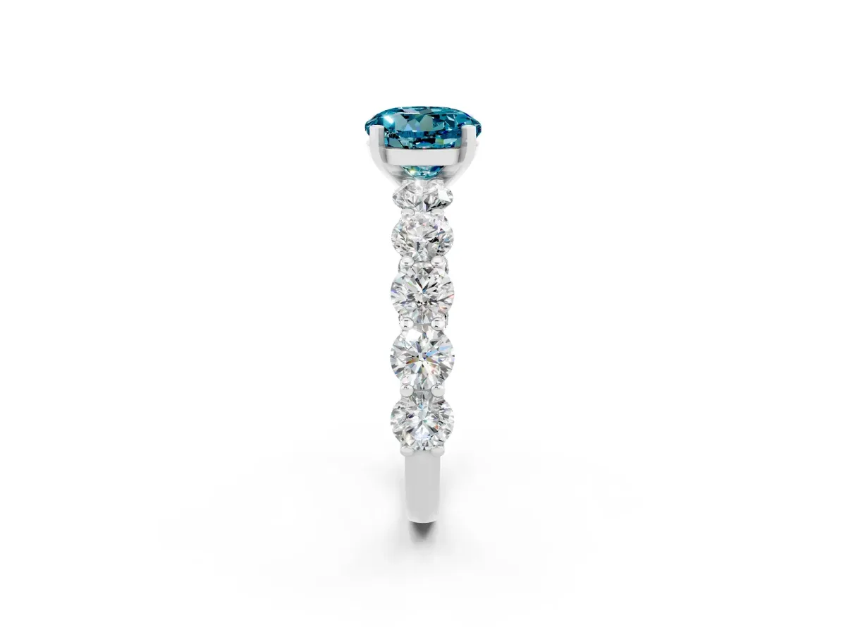 Round Cut Blue Topaz Prong Setting with Side Stones on a Pave Band Silver