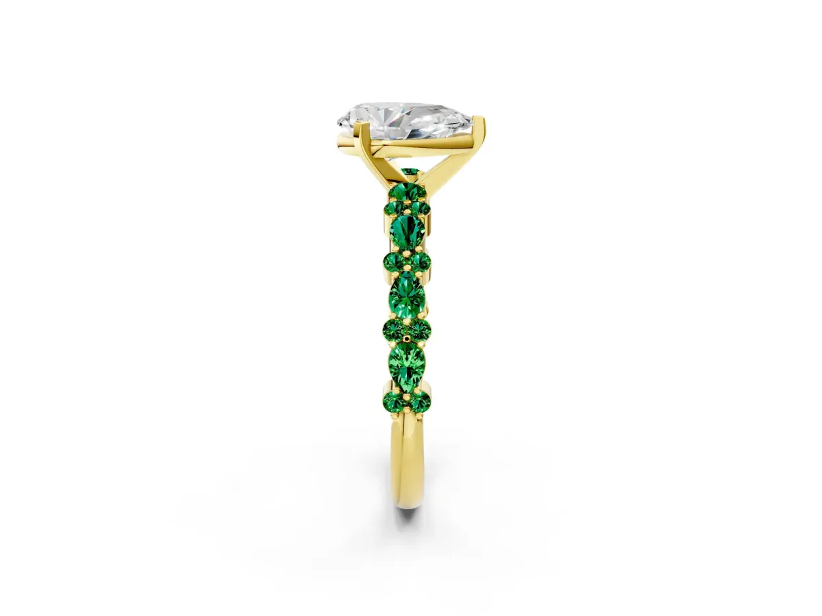 Pear Cut Diamond Side Stone Solitaire Ring with Round Emerald and Four-Prong Setting Yellow gold
