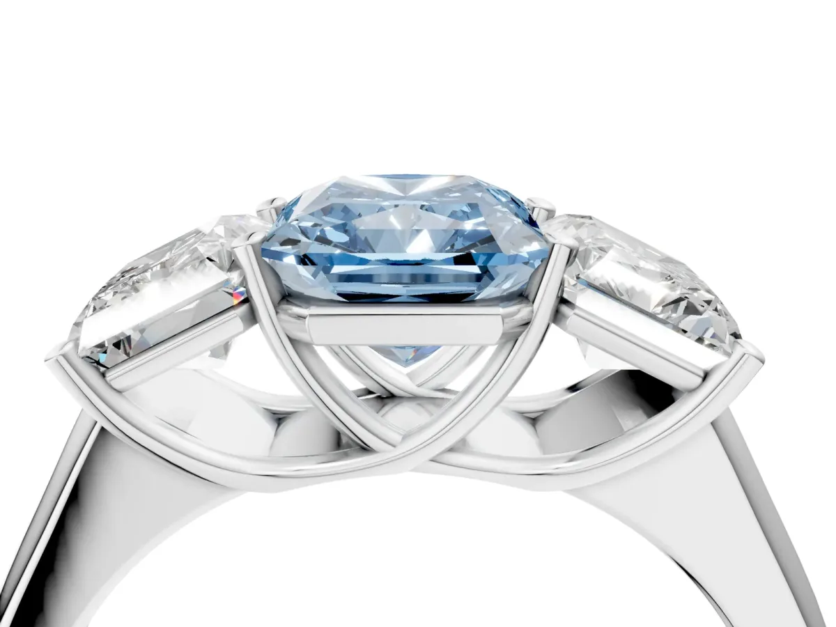 Fancy Blue Radiant Cut Three-Stone Diamond Ring with Prong Setting on a Classic Band Platinum