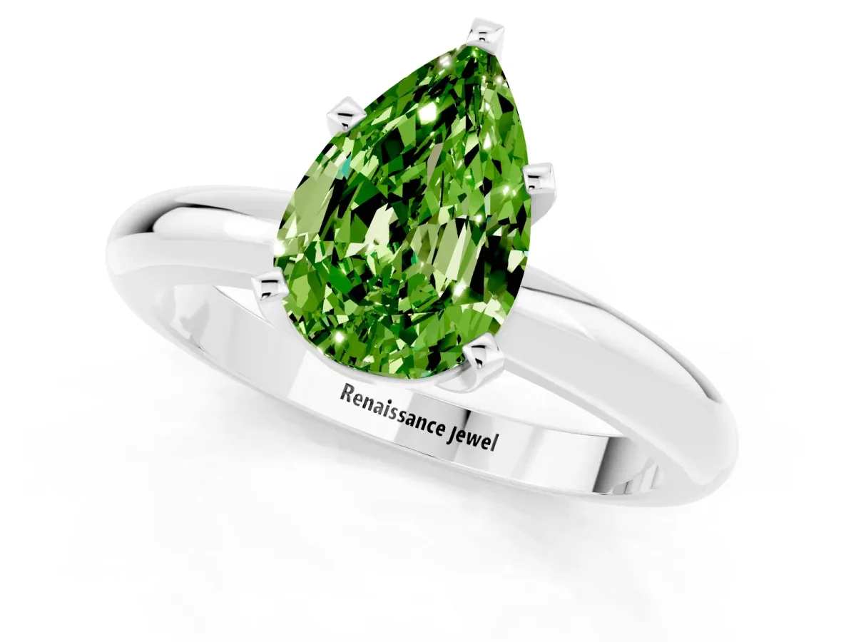 Pear Cut Peridot Solitaire Engagement Ring with Round Band and Four-Prong Setting Silver
