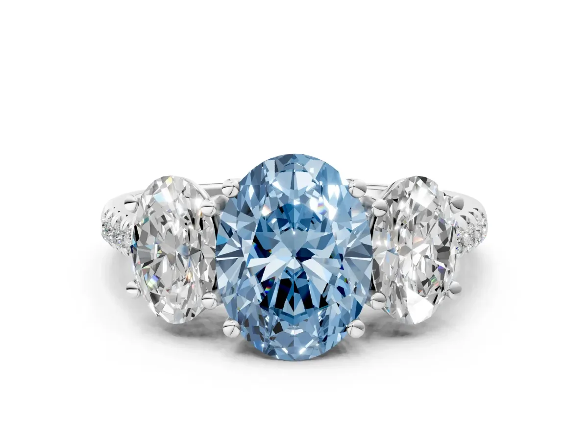 Fancy Blue Three-Stone Oval Cut Diamond Ring with Round Pavé Band and Prong Setting Platinum