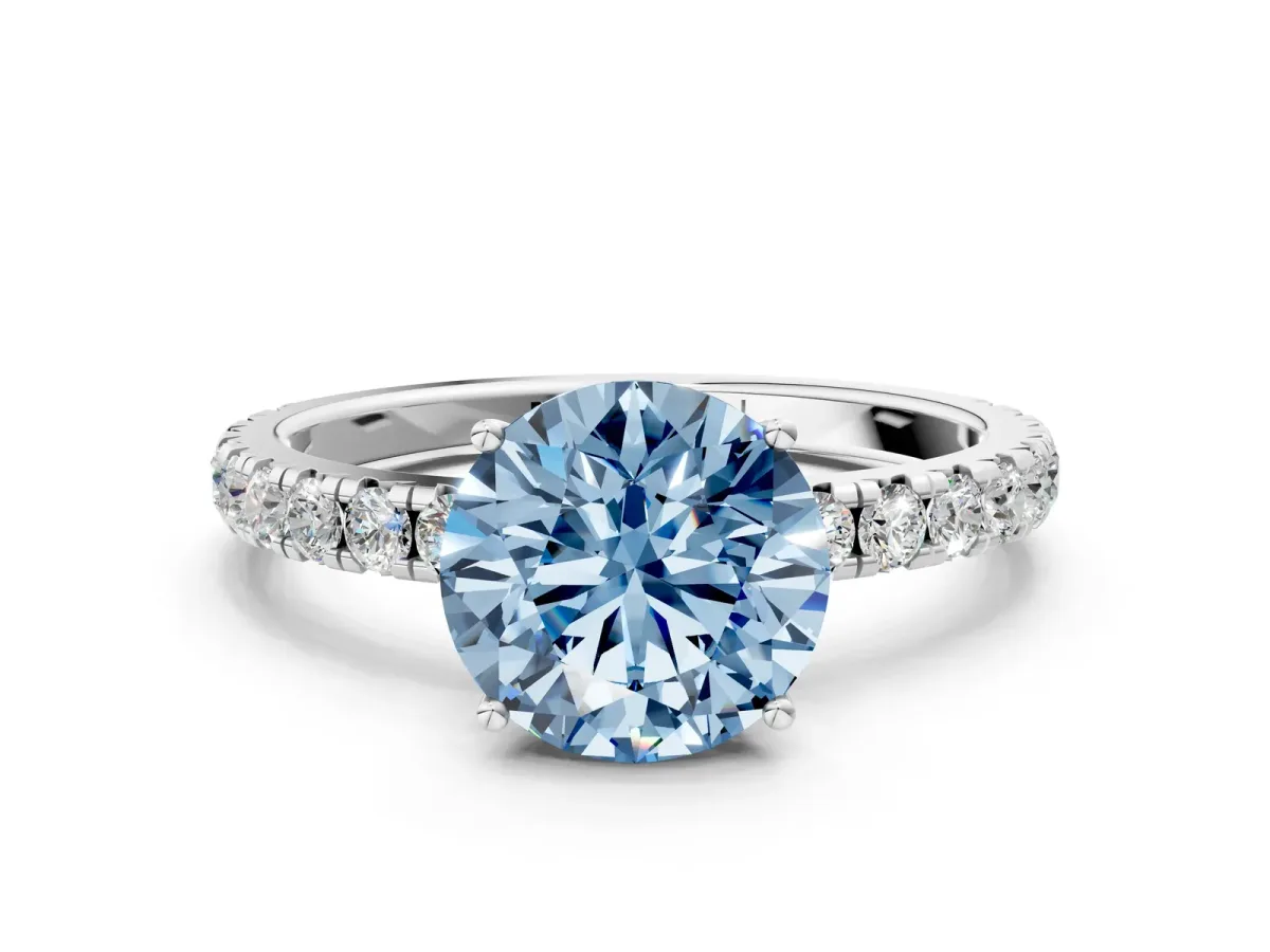 Fancy Blue Round Cut Diamond Pavé Solitaire Engagement Ring with Four-Prong Setting Silver