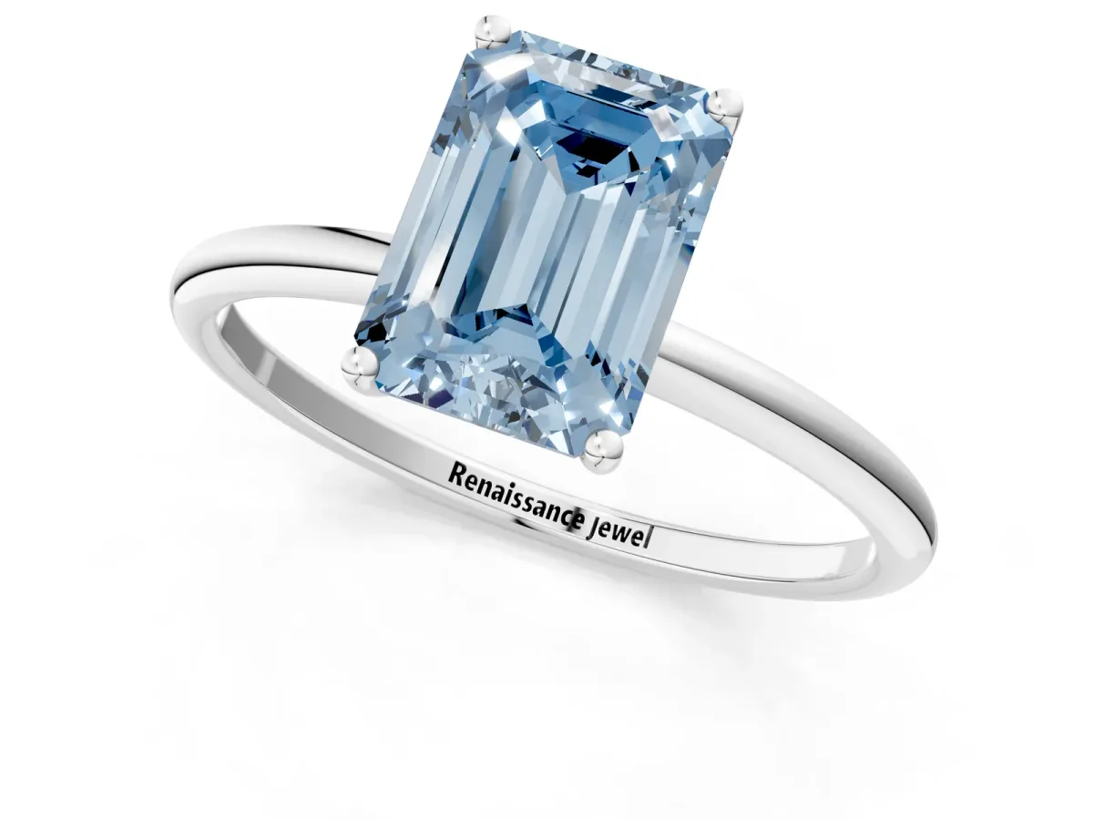 Fancy Blue Emerald Cut Cut Solitaire Engagement Ring with Thin Band and Four-Prong Setting Silver