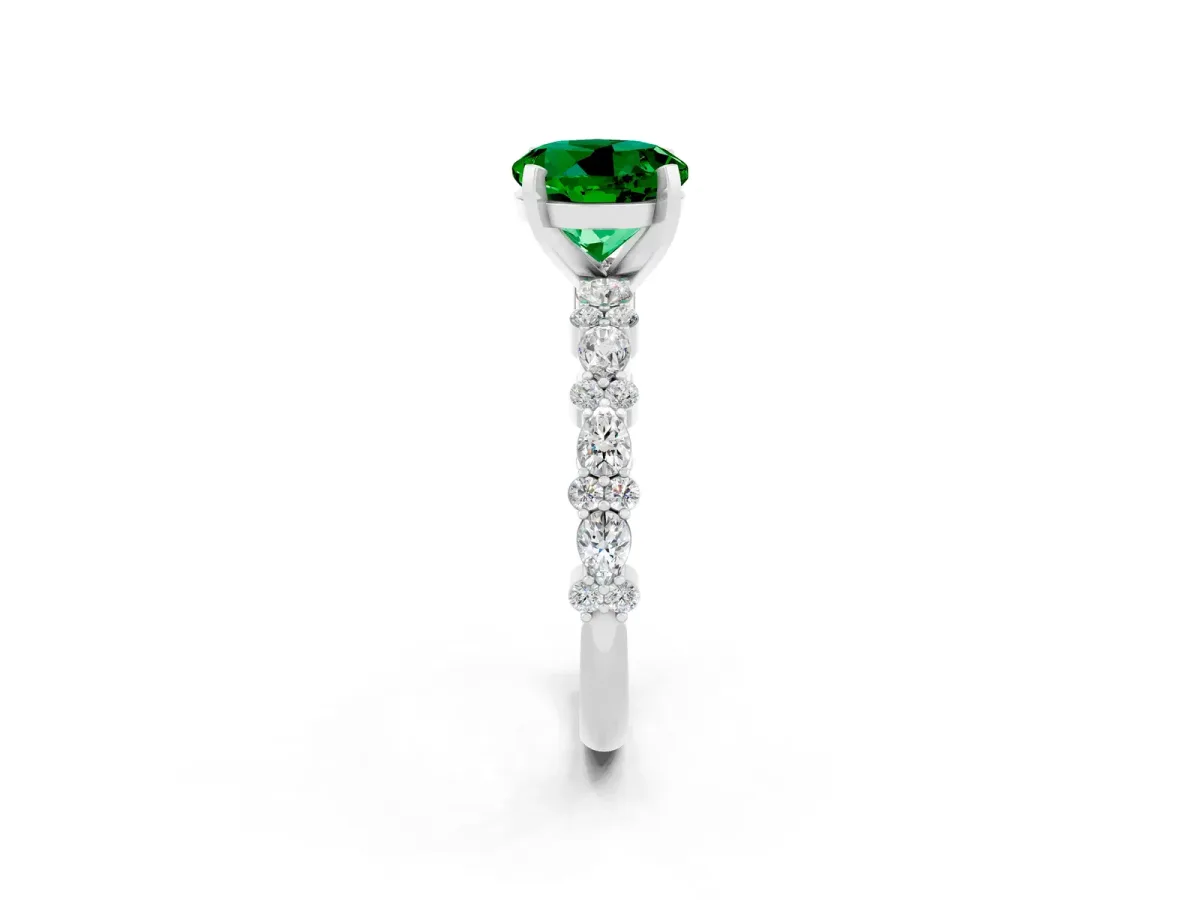 Round Cut Emerald Side Stone Solitaire Ring with Round and Four-Prong Setting Silver